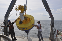 Will Ostrom and Jeff Pietro recovering an ESP buoy to Tioga.