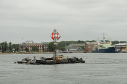 Great Harbor channel marker with MBL and WHOI buildings in background.