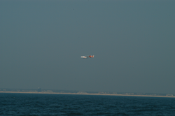 Low flying USCG plane flying along the coast.