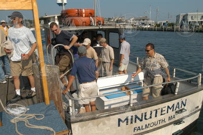 Minuteman skipper Emile Tietje (blue shirt) escorting guests off vessel.