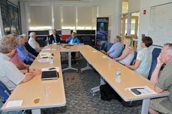 U.S. Senator Edward Markey talking with Susan Avery and other WHOI personnel.