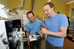 Mak Saito and Matt McIlvin with the new mass spectrometer in the Saito lab.