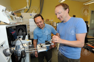 Mak Saito and Matt McIlvin with the new mass spectrometer in the Saito lab.