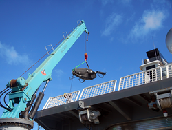 VPR suspended from a crane during the load onto Alucia.