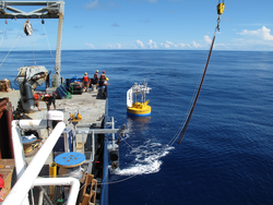 WHOI surface buoy in the water after deployment is complete.