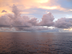 Cloud and ocean surface interaction on the horizon.