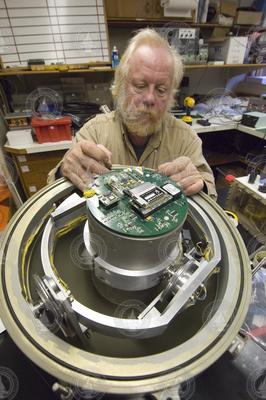 Victor Bender working on an ocean bottom seismometer.