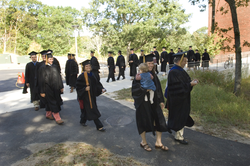 Joint Program graduates proceeding to the tent for commencement.