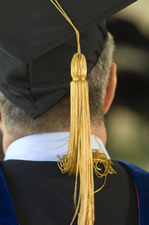 Graduation tassel on the back of a Joint Program graduate.