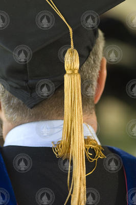 Graduation tassel on the back of a Joint Program graduate.