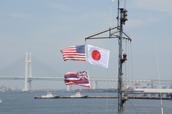 Flags flying from the mast of R/V Ka'imikai-O-Kanaloa (KOK) .