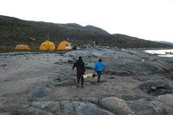 Jeff Pietro and Amy Kukulya hauling the REMUS 100 back to camp in Greenland.
