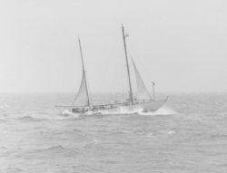 Original R/V Atlantis on rolling seas under abbreviated sail power.