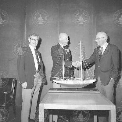 RV Atlantis model being presented to Charles Adams.