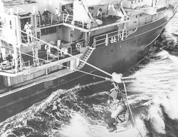 Fritz Hess transfers by highline from USS Hazelwood to R/V Atlantis II during Thresher search.