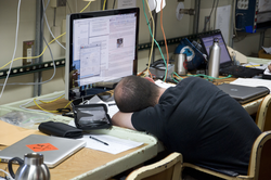 Alec Bogdanoff catching some sleep during a work break.