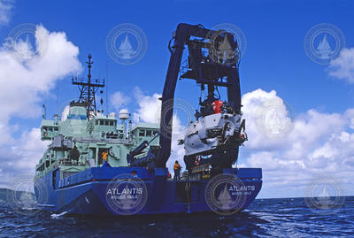 R/V Atlantis stern quarter shot, with Alvin suspended in A-frame during recovery.