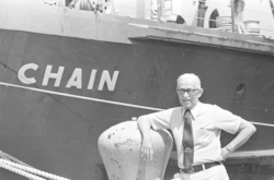 Director Paul M. Fye in front of R/V Chain.