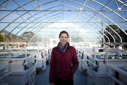 Amanda Spivak standing in front of the Mesocosm system.