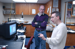 David Schneider and Bernhard Peucker-Ehrenbrink working in the lab.
