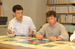 Jian Lin and Greg Hirth looking at maps.