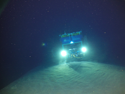 View of ROV Jason front and lit up near the ocean bottom.