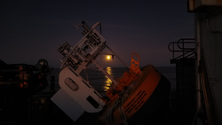 Moonlight beyond Stratus 16 surface buoy aboard R/V Ronald H. Brown.