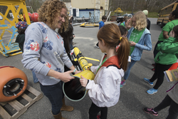 Diana Wickman (left) showing the students an OOI glider.