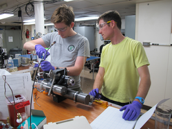 Jesse McNichol and François Thomas working on an IGT sampler on R/V Atlantis.
