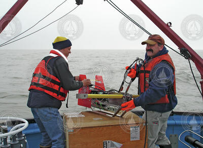 Steve Okkenen and Phil Alatalo deploying a towed Acrobat instrument.