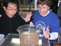 Biologists Jun Nishikawa and Patricia Kremer playfully mocking surprise.