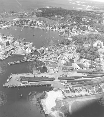Aerial view of Woods Hole, dock area, and train on tracks.