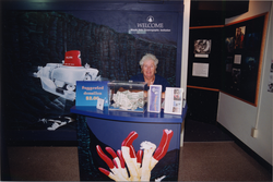 A WHOI volunteer working the Exhibit Center entrance.