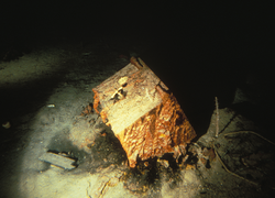 Rust covered safe in the debris field of Titanic on the seafloor.