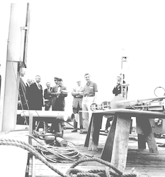 Buoys on display; Paul Fye talking to group on deck