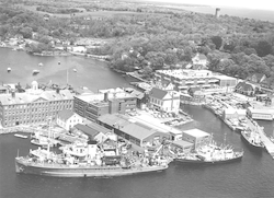 Aerial view of WHOI village facilities with R/V Chain and R/V Crawford at dock.