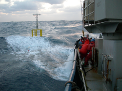 Air Sea Interaction Spar in the water just off the R/V Atlantis.