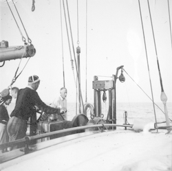 Henry Bigelow (center left) on deck of R/V Atlantis with others.