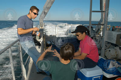 Brennan Phillips, Nan Trowbridge and Heidi Sosik aboard Tioga.