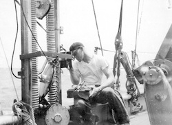 Dick Edwards next to winch on deck of Atlantis