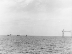 Texas Tower legs in position, tugboats in view