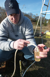 Dan Rogers doing groundwater testing in Waquoit Bay.
