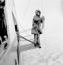 Eloise Soderland working hydrostation over icy water below.
