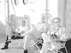 Three men on deck of Gosnold, Elazar Uchupi on left.