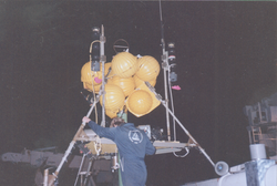 Preparing instrumentation and buoy on deck of Knorr