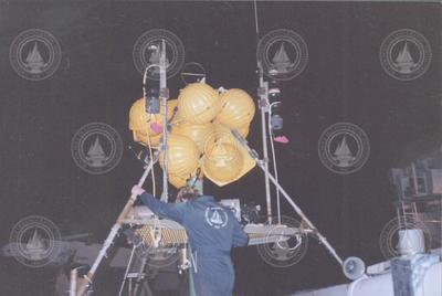 Preparing instrumentation and buoy on deck of Knorr
